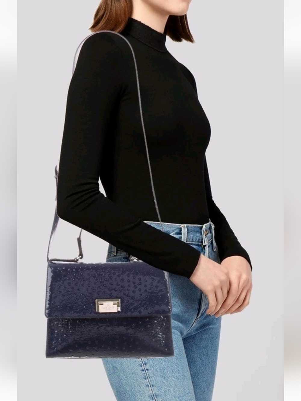 Kate Spade New York black patent leather handbag with an ostrich-embossed...